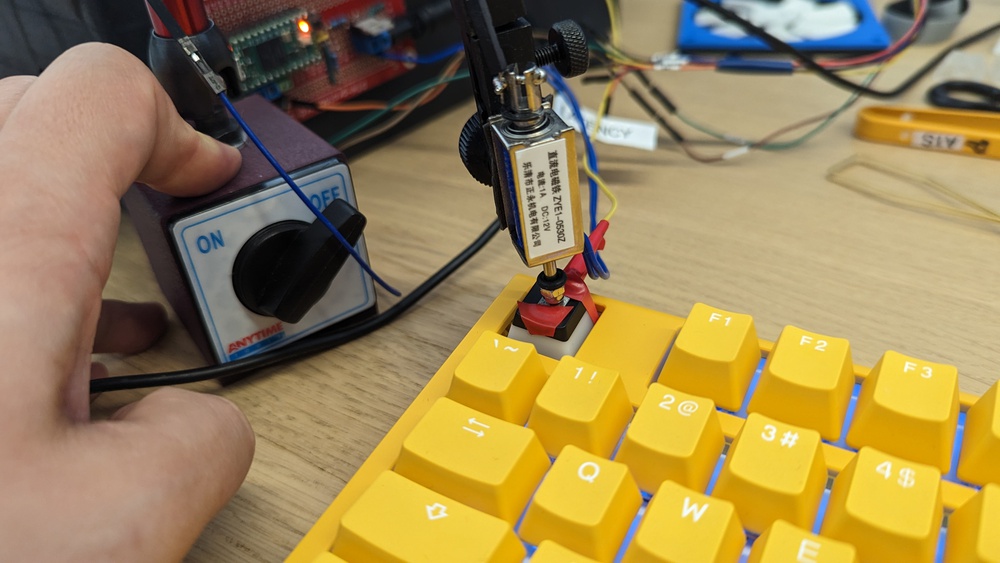 An image of our test rig actuating a switch on the Ducky One 3.